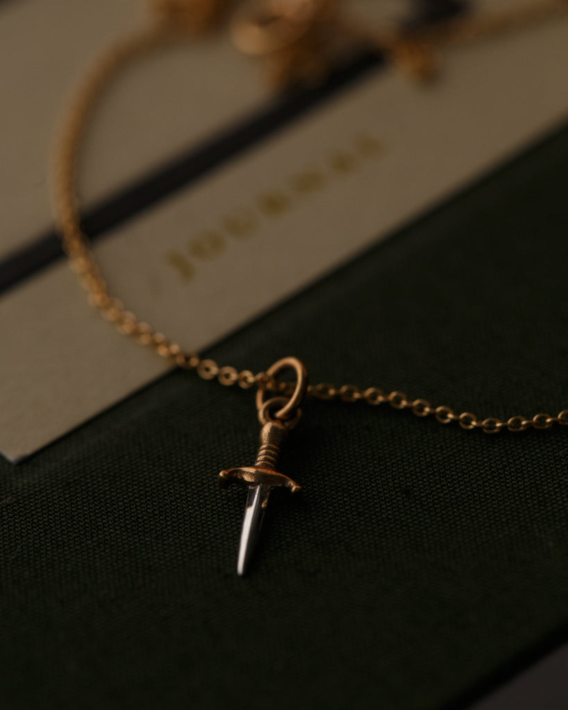 tiny dagger gold necklace